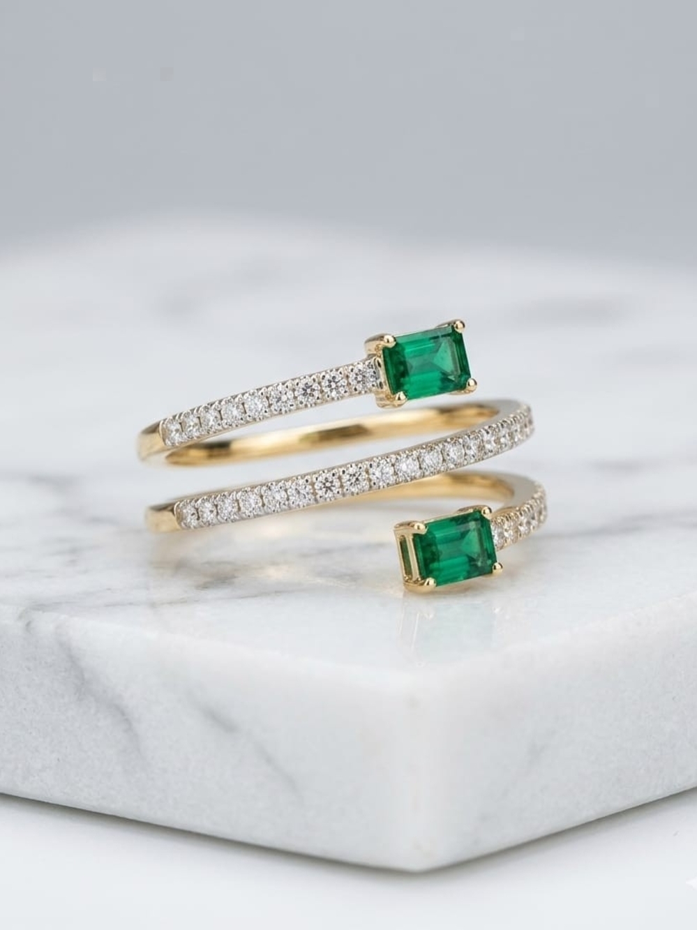 Gold Spiral Ring with Green Emeralds and Pavé Diamonds